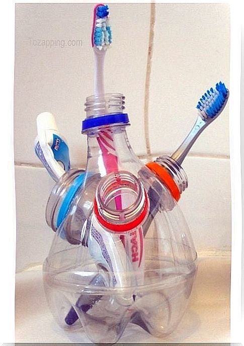 Bottle toothbrush holder