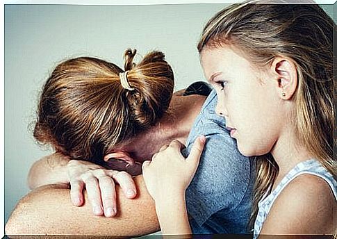 Girl comforting her mother