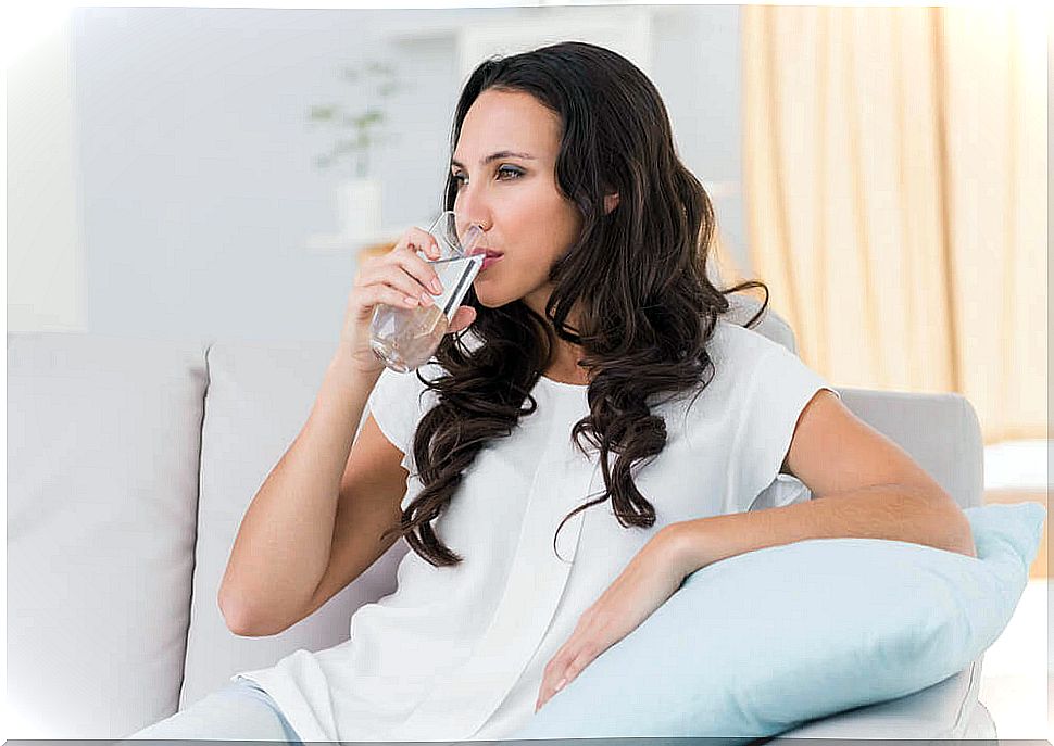 Woman drinking a glass of water