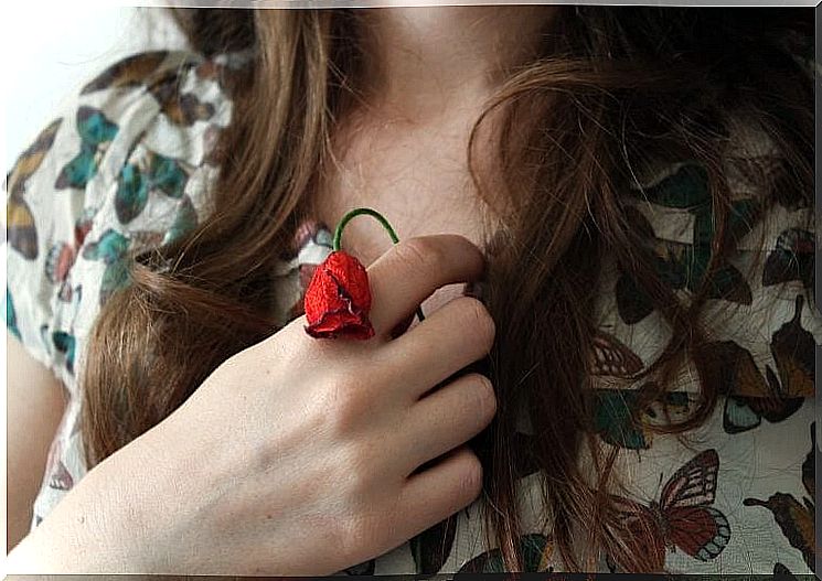 Woman with withered flower.