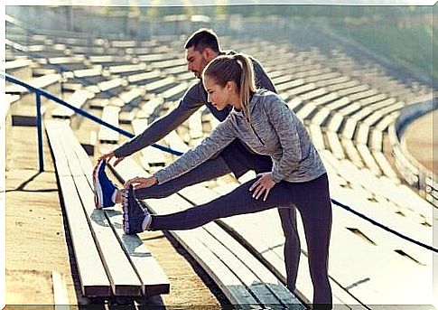 Two people stretch out