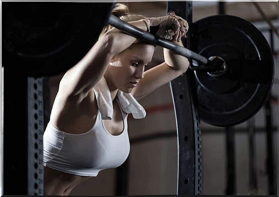 Woman has rest during weight training