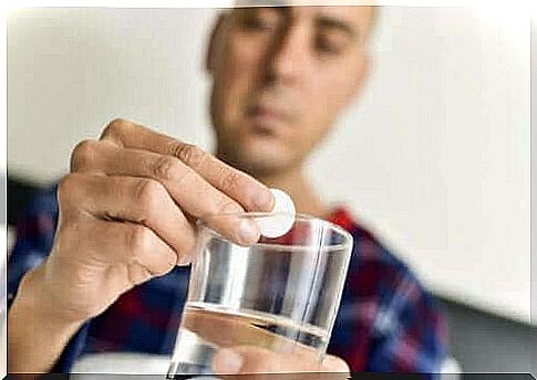 Man sitting with pill