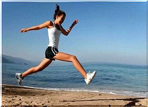 Woman exercising on beach to prevent bone loss