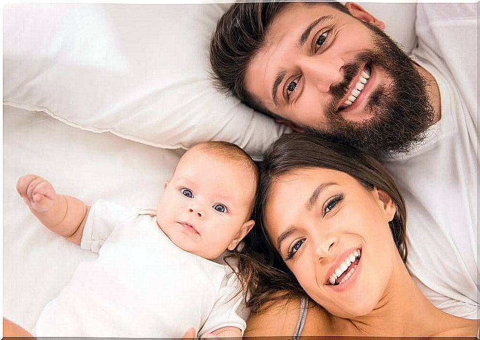 happy parents with newborn baby