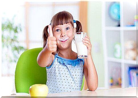 Girl with a milk beard, despite there being some disadvantages to drinking milk