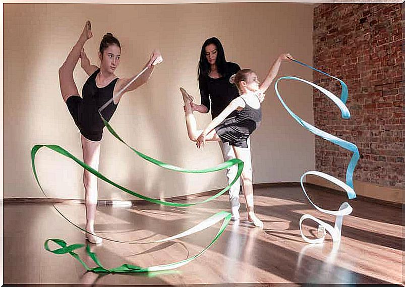 Two girls practicing sports acrobatics