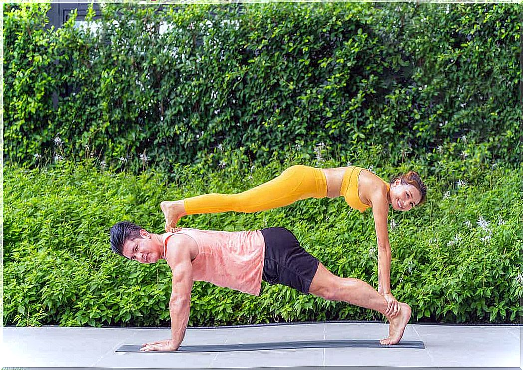 A man and woman who practice sports acrobatics