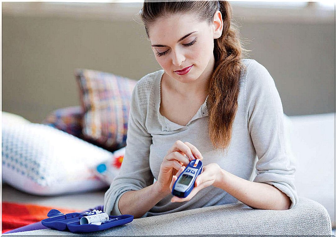 Woman with blood glucose meter